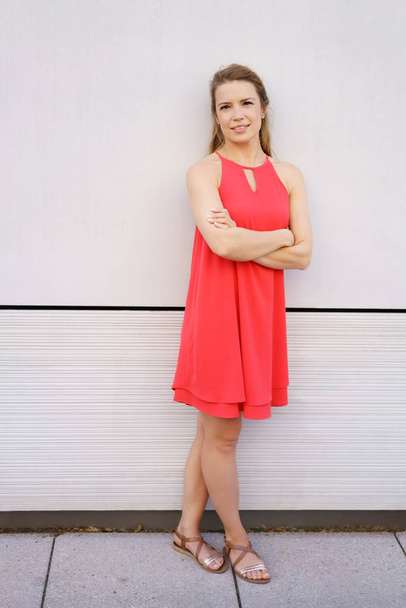 Trendy young woman in a red summer dress - Foto, immagini