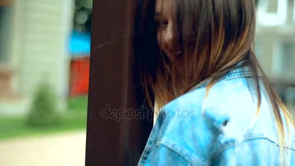 young beautiful girl with red lips walks and smiles on camera - Záběry, video