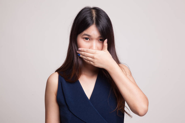 Young Asian woman close her mouth with hand. - Zdjęcie, obraz