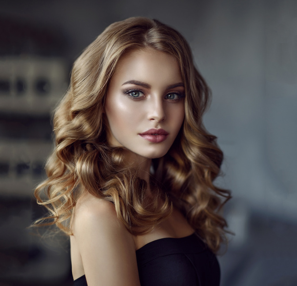 girl with long  and   shiny curly hair . - Photo, Image