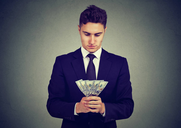 Ambitious young business man with money  - Foto, imagen