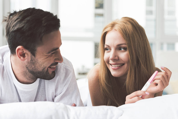 Happy woman telling man about her expectant position - Photo, Image
