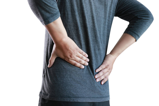 young man Feeling suffering  Lower back pain  Pain relief concep - Valokuva, kuva