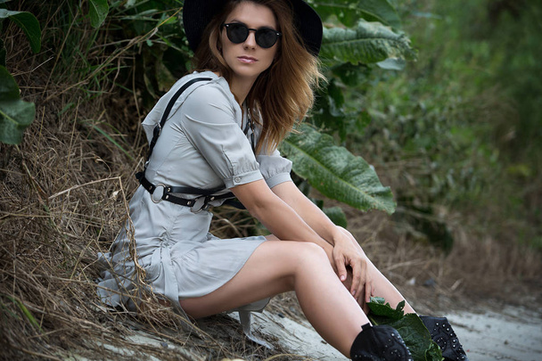 Portrait of a model girl in a beautiful dress, sunglasses and ha - Фото, зображення