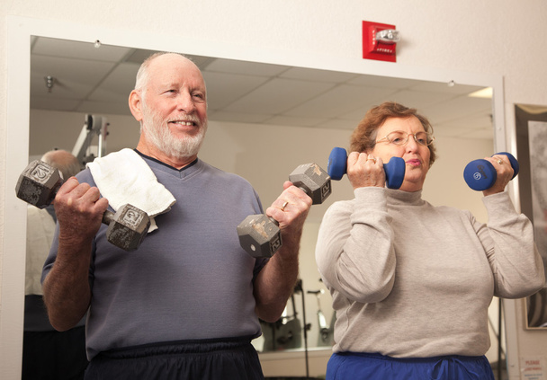 Senior Adult Couple Working Out in the Gym - Foto, immagini