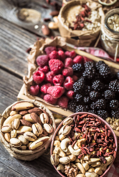 still life with raspberries and nuts - Fotoğraf, Görsel