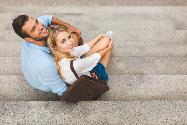 couple sitting on stairs on street - Foto, immagini
