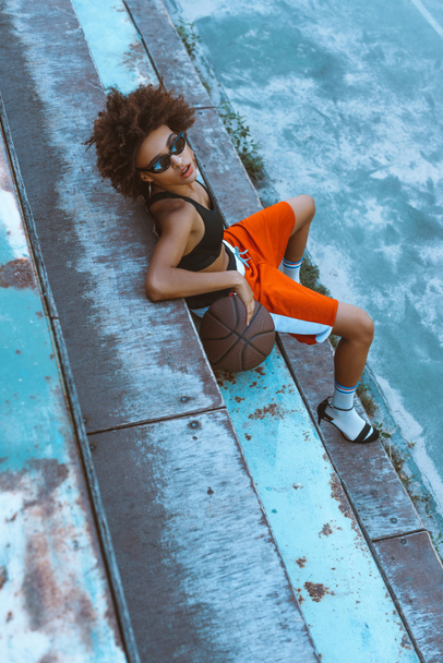 woman in sportswear and heels with basketball - Photo, Image