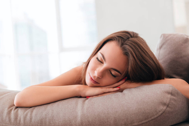 Pretty young woman sleeping on a pillow - Photo, Image