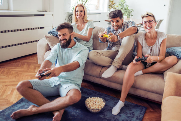 Friends playing video games - Photo, Image
