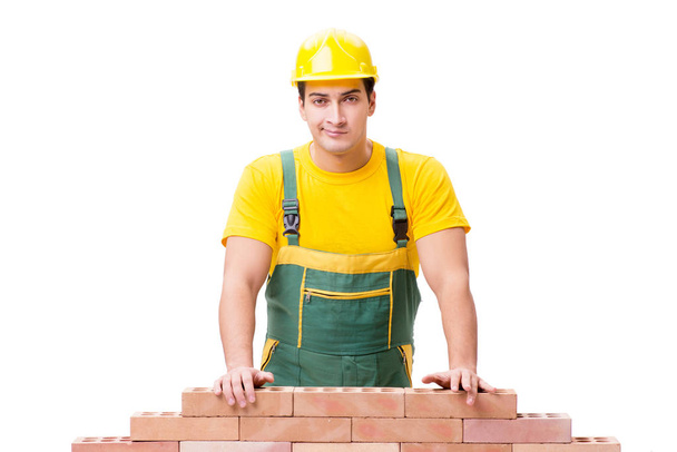 Hezký stavební dělník stavět cihlovou zeď - Fotografie, Obrázek