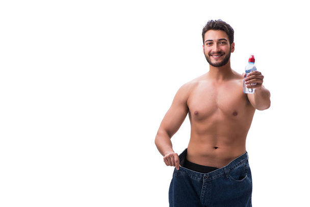 Человек в диете концепции с негабаритными джинсами
 - Фото, изображение