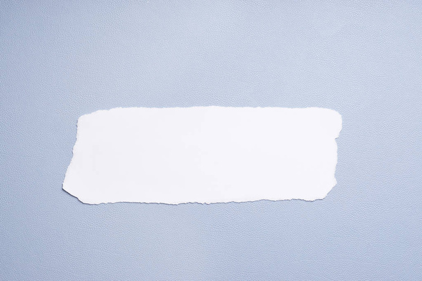 blank strip of paper on blue background - Foto, Imagem