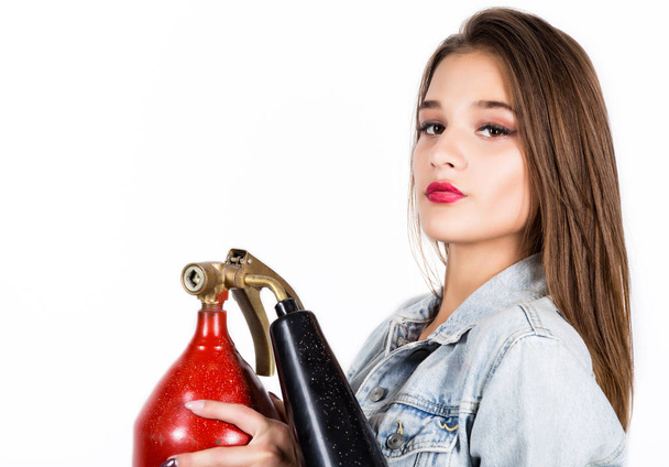 Sexy sensual female firefighter with a red fire extinguisher - Photo, image
