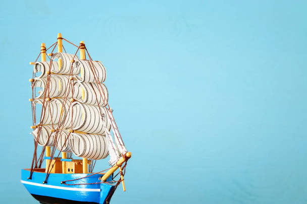 Columbus day concept with old ship over wooden background - Φωτογραφία, εικόνα