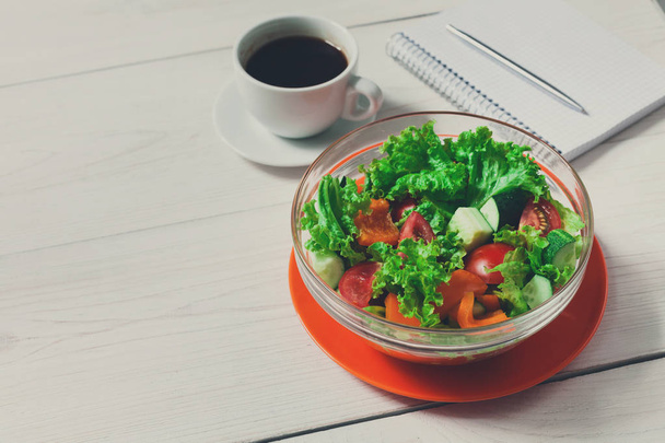 Healthy eating in office, vegetable salad bowl and coffee - Fotoğraf, Görsel