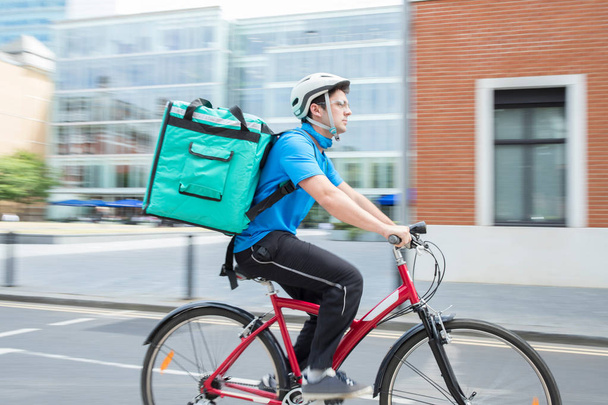 Courier On Bicycle Delivering Food In City - Photo, Image
