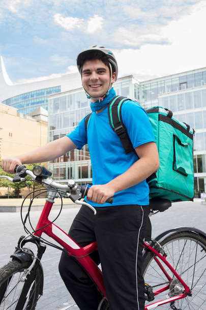 Portrait Of Courier On Bicycle Delivering Food In City  - Foto, Imagem