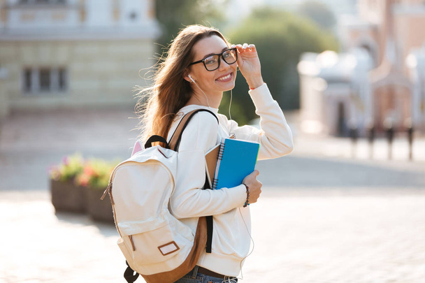 Side view of happy woman in eyeglasses and autumn clothes - Photo, Image