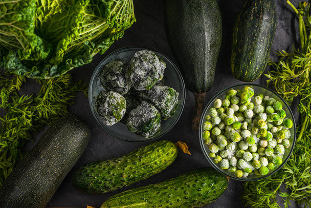 Background of green vegetables of cucumbers, Savoy cabbage - 写真・画像