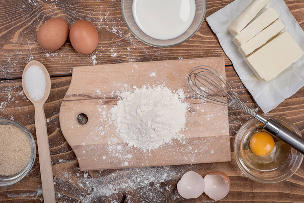 Dough recipe ingredients on vintage rural wood kitchen table - Fotó, kép