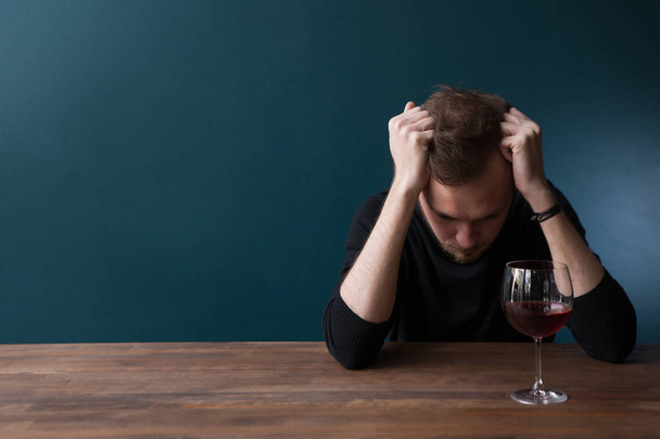Despondent young man in bar - Фото, изображение