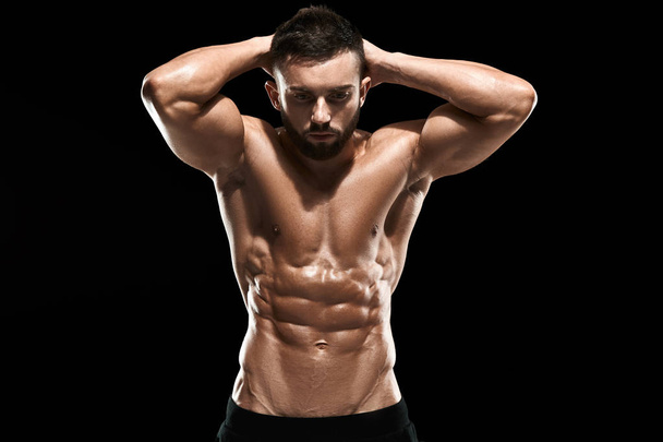 Muscular bodybuilder guy doing posing - Zdjęcie, obraz