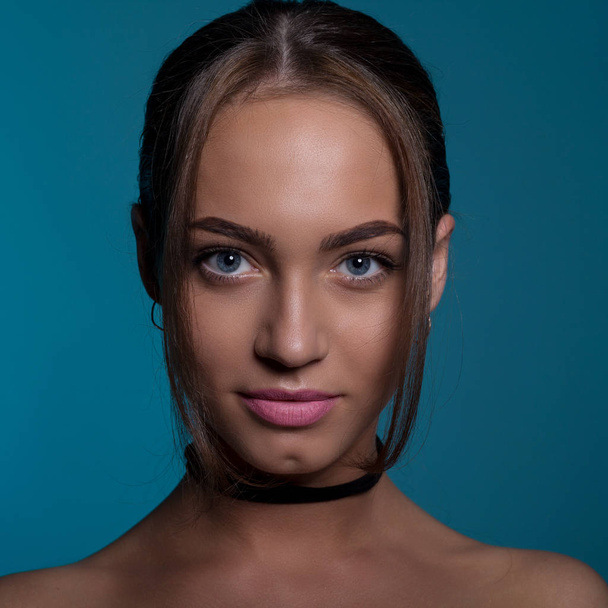 Portrait of a beautiful woman with blue eyes - Photo, Image