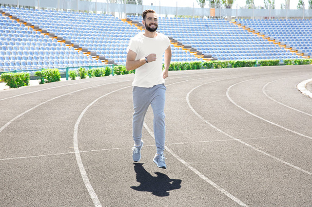 man running at stadium - Valokuva, kuva