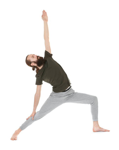 Young man practicing yoga - Foto, Imagen