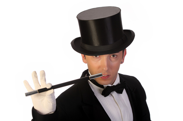 Young magician performing with wand - Foto, afbeelding