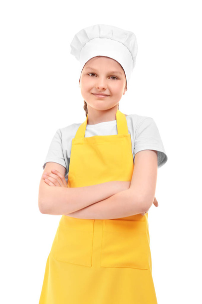 Cute girl in chef uniform on white background. Concept of cooking classes - 写真・画像