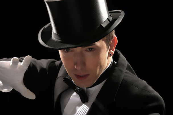 Young magician with high hat - Foto, imagen
