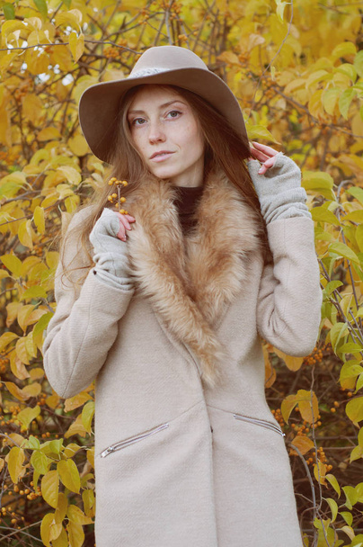 Retro look. Beautiful ash blond with long hair in fur coat and f - Photo, Image