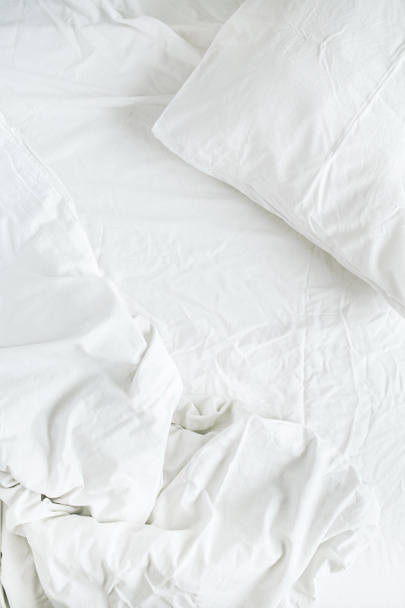 white bed with pillow, blanket and sheet - 写真・画像