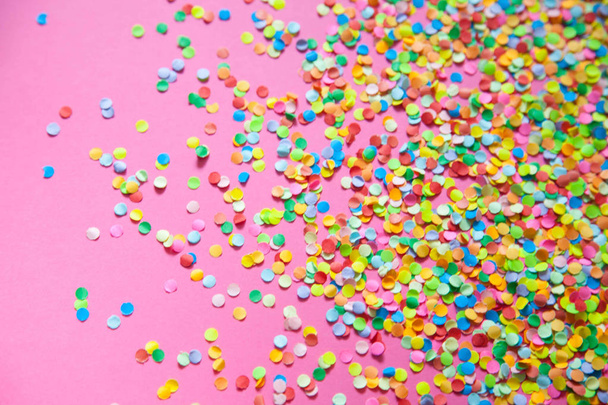 Frame made of colored confetti. Pink background.  - Fotoğraf, Görsel
