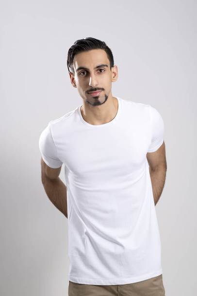 Handsome Young Man in Casual Clothing Over a White Background - Zdjęcie, obraz