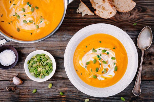 Homemade pumpkin soup with cream and seeds  - Photo, Image