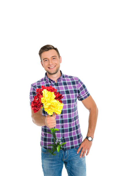 Kerl mit Blumen auf weißem Hintergrund - Foto, Bild
