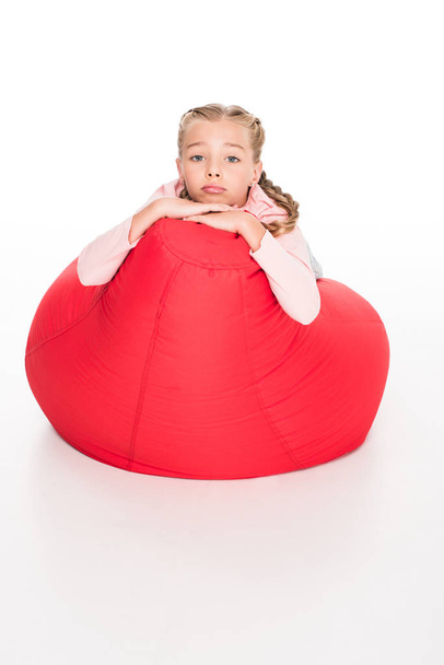 dissatisfied child on bean bag - Photo, image