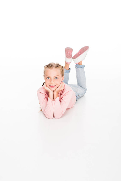 Happy child lying on floor  - Valokuva, kuva