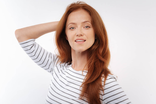 Ginger-haired woman posing on white background - Fotoğraf, Görsel