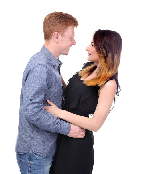 Happy young couple on white background - Foto, afbeelding