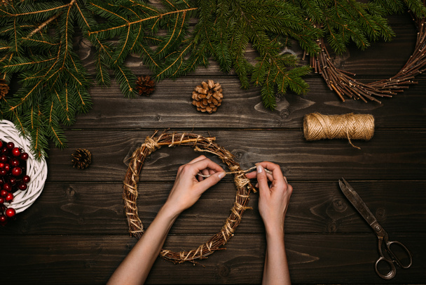 woman making Christmas wreaths - Photo, Image