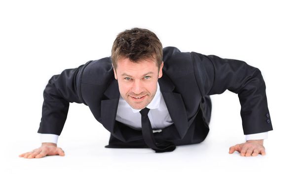 young businessman being wrung out from a floor - Foto, Imagem