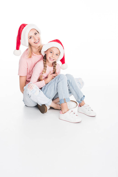 mother and daughter embracing on christmas - Foto, Imagen