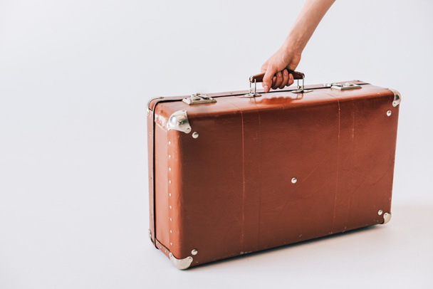 hand holding retro suitcase - Foto, afbeelding
