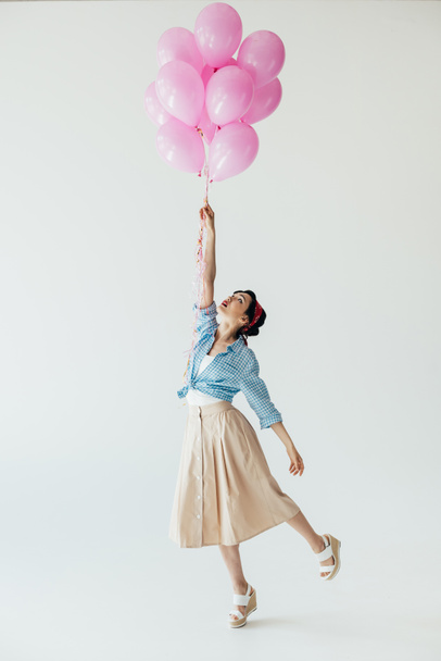 asian woman holding balloons - Foto, afbeelding