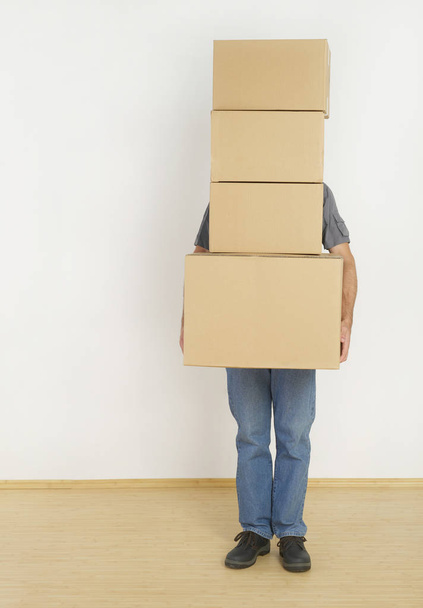 Man behind moving boxes - Fotoğraf, Görsel
