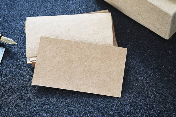 Blank business card mock up from cardboard on table for design business contact - Фото, зображення